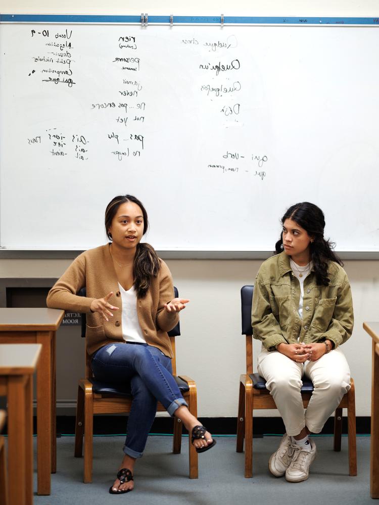 Two students discussing foreign languages